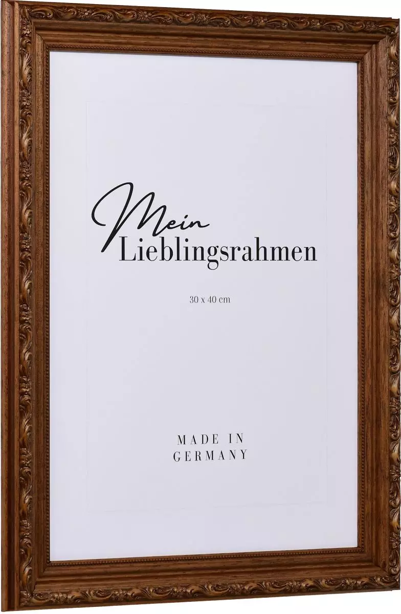 Seitenansicht eines braunen Holzrahmens im Barockstil mit rustikaler, nussbaumgebeizter Oberfläche, leicht schimmernden floralen Ornamenten und einem Perlstab an der Innenkante